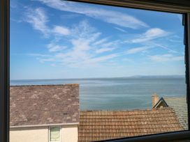 A view of water and sky through a window at Ferncliffe