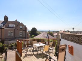 An outdoor area with a table and chairs at Ferncliffe