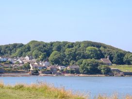 A view of houses and trees near water at Ferncliffe