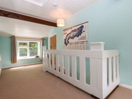 A hallway with a window and map at Neuadd Wen in Gaerwen