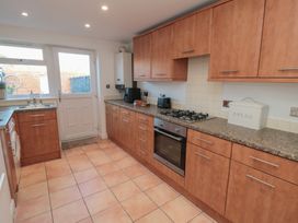 A kitchen with cabinets, appliances, and a door at 23 South Lackenby in Eston