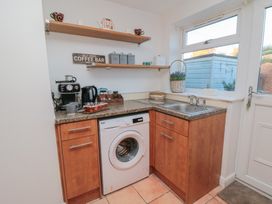 A kitchen with a washing machine and sink at 23 South Lackenby Eston