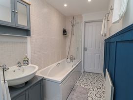 A bathroom with a bathtub and sink at 23 South Lackenby in Eston