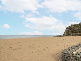 A beach with sand and sea at Awel Deg, Tresaith