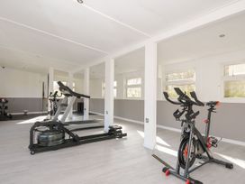 A gym with a treadmill and exercise bike at Trevano in St Breward