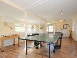 A game room with ping pong and foosball tables at Trebah in St Breward