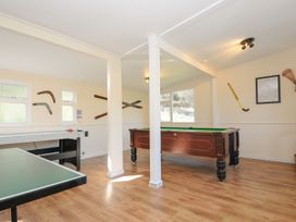 A game room with a pool table and air hockey table at Trebah in St Breward