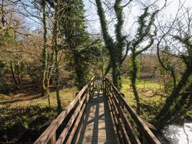 A bridge with trees on either side at Trebah in St Breward