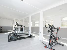 A gym with a treadmill and exercise bike at Polzeath St Breward