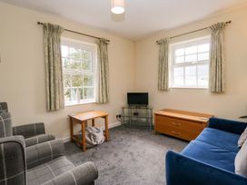 A living room with a sofa and coffee table at Buckbarrow in Seascale