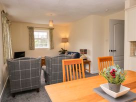 A living room with a sofa and armchairs at Buckbarrow in Seascale