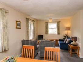 A living room with a sofa and armchairs at Buckbarrow in Seascale