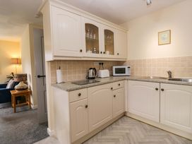 A kitchen with cabinets and appliances at Buckbarrow in Seascale