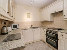 A kitchen with a sink and stove at Buckbarrow Seascale