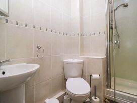 A bathroom with a sink, toilet, and shower at Buckbarrow Seascale