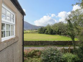 A view of a field with mountains in the background at Buckbarrow in Seascale
