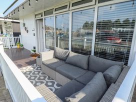 A patio with a sofa and decorative elements at 3 Cherry Blossom in Skegness