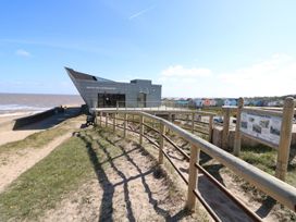 A building with a pathway leading to it at the North Sea Observatory in Skegness