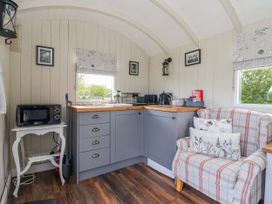 A kitchen with a microwave and sink at The Dragonfly Bewholme near Hornsea