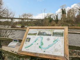 An information sign with a map by a river at Cariad Cottage Hereford