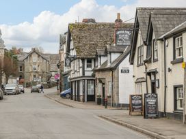 A street view with buildings and signs at Cariad Cottage in Hereford