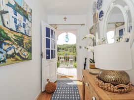 A hallway with a view of the outdoor area at Mayhurst in Looe