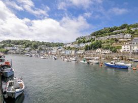 A harbor with boats and houses at Mayhurst in Looe