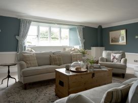 A living room with sofas and coffee table at Holwell Farmhouse in Bampton