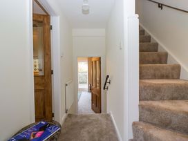 A hallway with a staircase leading to the upper floor at 11 Tram Lane Kirkby Lonsdale
