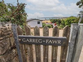 A gate with a sign for Garreg Fawr leading to a landscape view at Garreg Fawr