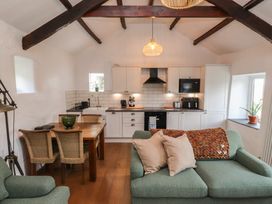 A kitchen with dining area and seating at Garreg Fawr 