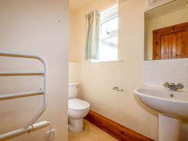 A bathroom with a toilet and sink at Rosewin Farmhouse near St Minver