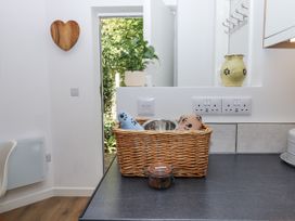 A kitchen with a basket and a plant at The Workshop in Mary Tavy