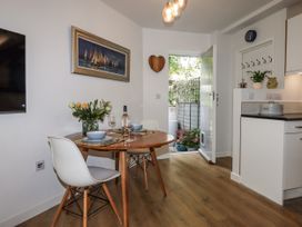 A dining room with a round table and chairs at The Workshop in Mary Tavy
