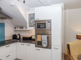 A kitchen with appliances including a microwave and kettle at The Workshop in Mary Tavy