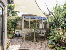 A garden with a table and chairs at The Workshop in Mary Tavy