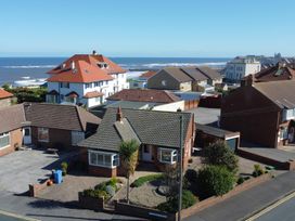 A view of houses and the sea at Roseberry in Whitby