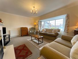 A living room with a sofa and coffee table at Roseberry in Whitby