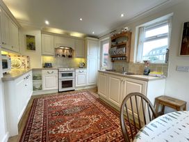 A kitchen with a stove and microwave at Roseberry in Whitby