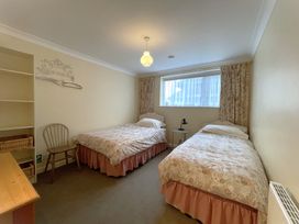 A bedroom with two single beds at Roseberry in Whitby