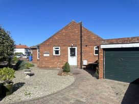 A house with a garage and garden at Roseberry in Whitby
