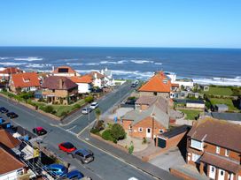 A street with houses and ocean view at Roseberry in Whitby