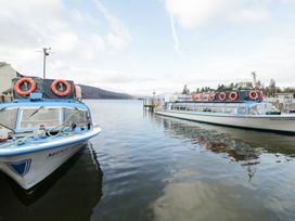 Two boats with life rings on a lake at Easedale Lodge, Waterside Wood 2, White Cross Bay near Windermere