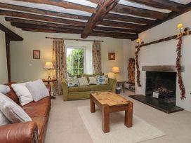 A living room with a sofa and coffee table at The Old Manor House in Lifton