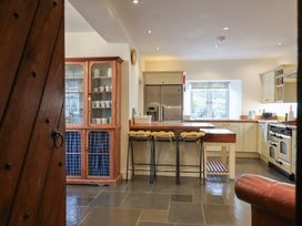 A kitchen with a refrigerator and stove at The Old Manor House in Lifton