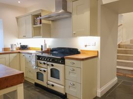 A kitchen with an oven and stovetop at The Old Manor House in Lifton