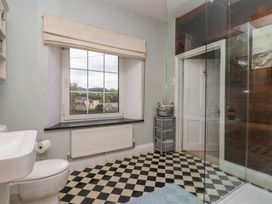 A bathroom with a shower and toilet at The Old Manor House in Lifton