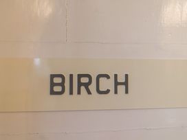 A sign with the word BIRCH at The Old Manor House in Lifton