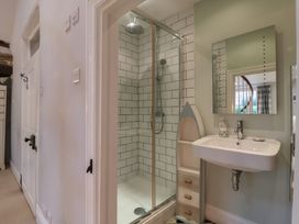 A bathroom with a shower and sink at The Old Manor House in Lifton