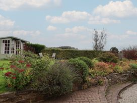 A garden with plants and a shed at The Old Manor House in Lifton